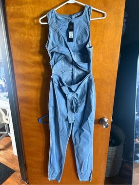 Fashion Nova Light Wash Denim Jumpsuit with Cut-Out Detail